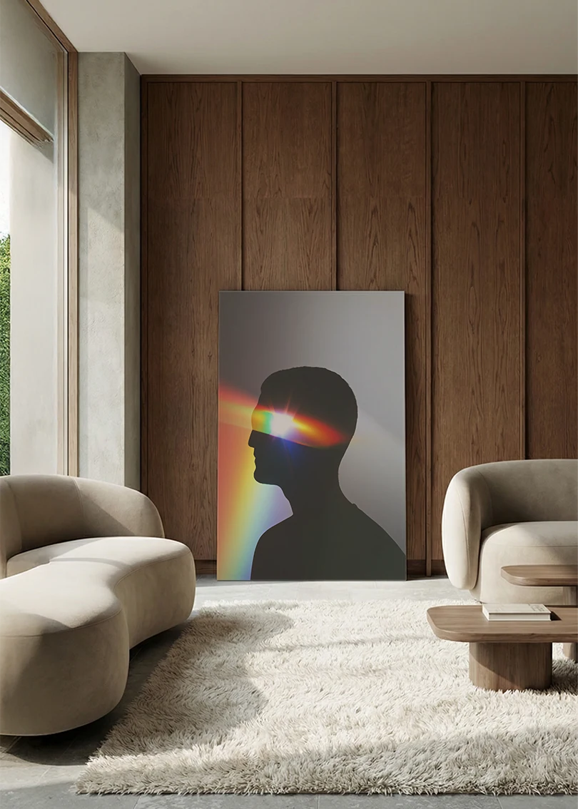 Akustikbillede med en profil med regnbuefarvet lys, i en lounge med bugtet sofa mod valnød